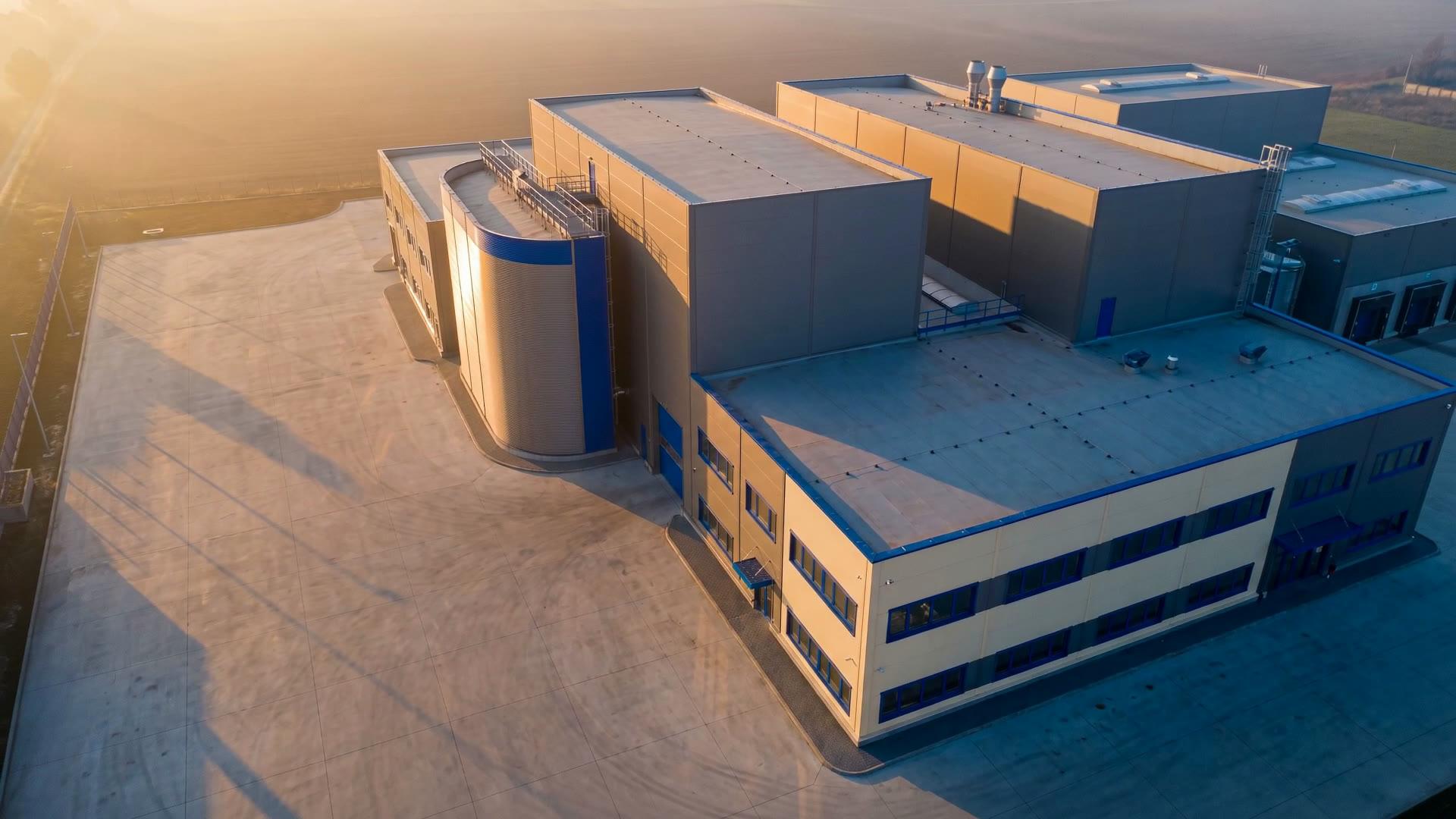 Golden-hour aerial of an industrial facility — the final frame of the ShiftNode homepage film